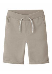 Pantalones cortos beige de tela suave, con una cinturilla acanalada, cordón ajustable con un acento estampado y dobladillos enrollados. Dos bolsillos laterales.