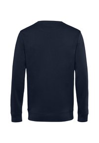 Felpa blu navy con scollatura rotonda, maniche lunghe e polsini a coste. Tessuto liscio senza loghi o motivi visibili.