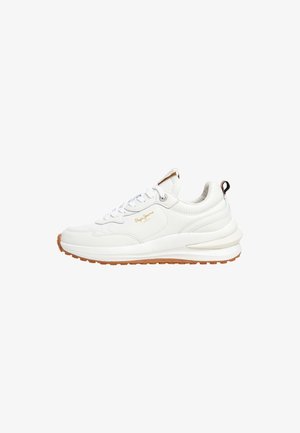 White leather sneaker with round toe, textured upper, and rubber sole. Features white laces, logo detail, and contrasting tan accents on sole.