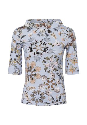 Light blue shirt with 3/4 sleeves, featuring a symmetrical nature print of leaves, pinecones, flowers, mushrooms, birds, and small animals.