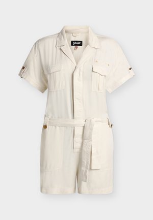 Combinaison-short crème à manches courtes avec ceinture, col, fermeture à boutons sur le devant, poches poitrine et manches retroussées avec pattes boutonnées.