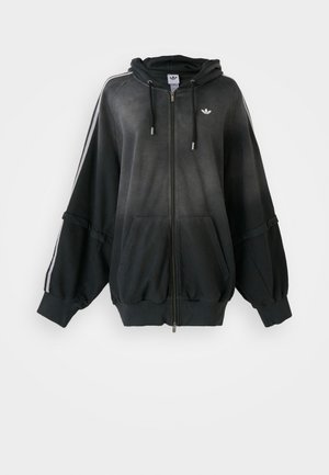 Black zip-up hoodie with a gradient finish, oversized fit, ribbed cuffs, side pockets, and white horizontal stripes along the shoulders.