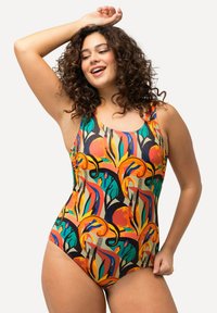 Badpak met een kleurrijk bloem- en abstract patroon in oranje, groen en blauw. Het materiaal is rekbaar, met een ronde hals en brede schouderbanden.