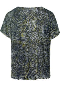 Blouse à manches courtes avec motif abstrait en spirale noir, blanc et vert olive, offrant une coupe ample et un ourlet froncé.