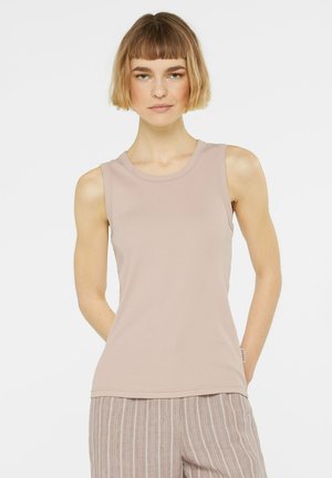 Light pink sleeveless top with a round neckline, ribbed texture, and a straight cut, paired with light striped pants.