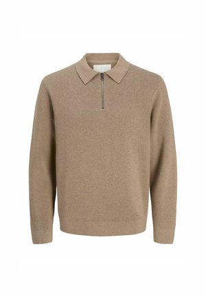 Pull-over en tricot beige à manches longues avec un col et une courte fermeture éclair à l'avant, présenté sur un fond blanc.