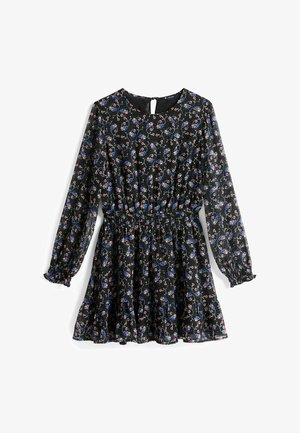 Black floral dress with long sleeves, gathered waist, ruffled hem, featuring red, blue, and white floral patterns on a textured fabric.