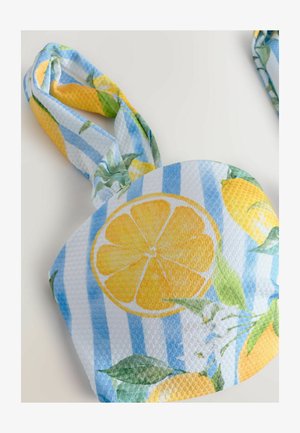 Tissu à motif citron avec des rayures bleues et blanches. Tissu texturé avec des feuilles vertes et des citrons jaunes. Design noué en haut pour la manipulation.