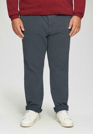 - Spodnie materiałowe