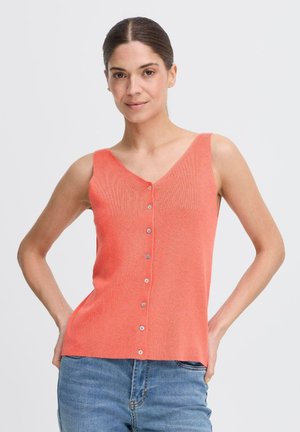 Coral ribbed knit tank top with a V-neck, featuring five buttons down the front and wide straps, paired with blue denim jeans.