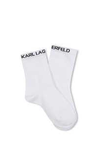 Calzini bianchi in cotone con logo "KARL LAGERFELD" nero sul polsino a coste, caratterizzati da una texture liscia e un design classico alla caviglia.