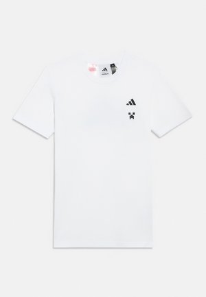 White short-sleeve t-shirt with small black Adidas logo and pixelated Creeper face from Minecraft on the upper left chest area.