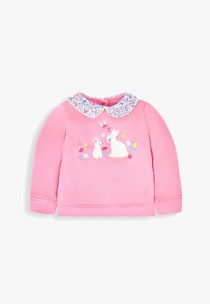 Lyserød sweatshirt med lange ærmer og blomstret krave. Har broderede kaniner og blomster foran. Blødt bomuldsstof.