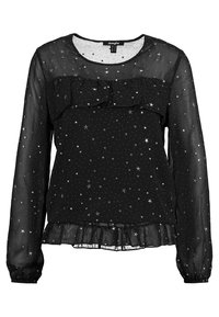 Blouse noire transparente à manches longues avec motif d'étoiles argentées, détail à volants sur la poitrine et ourlet à volants à la taille.