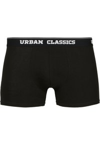 Schwarze Baumwoll-Boxershorts mit eng anliegendem Schnitt, einem weichen Bund mit "URBAN CLASSICS" in weißer Schrift und ohne zusätzliche Muster.