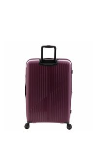 Hard-shell violet suitcase with a vertical ribbed design, black telescopic handle, four wheels, and a zipper closure.