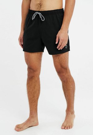 Schwarze Badehorts aus leichtem Material mit elastischem Bund und kontrastierendem Kordelzug. Mit seitlichem Logo und geradem Schnitt.