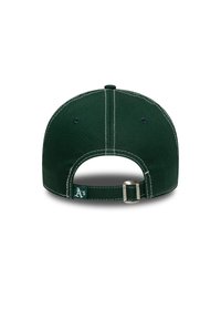 Green baseball cap with a curved brim, cotton fabric, white stitching, adjustable strap, and logo tag on the back.