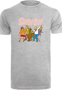 Grå bomull t-skjorte med et fargerikt bilde av fem tegn fra tegneserier, inkludert en hund, med teksten "Scooby-Doo!" over.