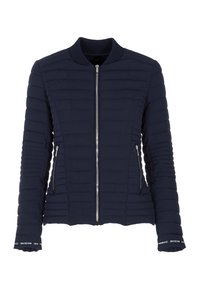 Veste bomber matelassée bleu marine avec fermeture éclair devant, poches latérales zippées, col côtelé et poignets siglés.