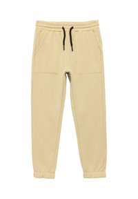 Beige Jogginghose mit elastischem Bund, schwarzem Kordelzug und zwei Fronttaschen; schmal zulaufende Beine mit genähten Bündchen an den Knöcheln.