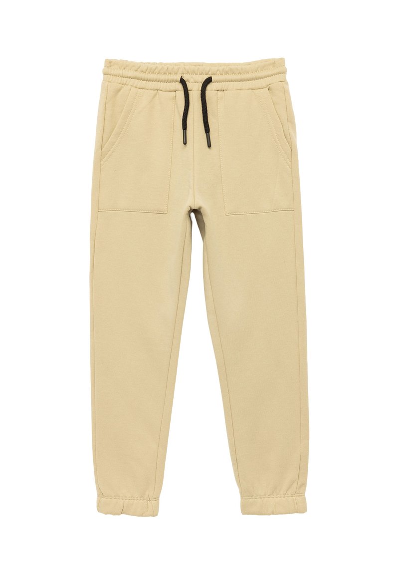 Beige Jogginghose mit elastischem Bund, schwarzem Kordelzug und zwei Fronttaschen; schmal zulaufende Beine mit genähten Bündchen an den Knöcheln.