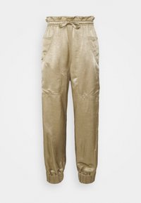 Pantalones jogger de satén beige con cintura elástica, detalle de lazo, bolsillos laterales y puños elásticos fruncidos.