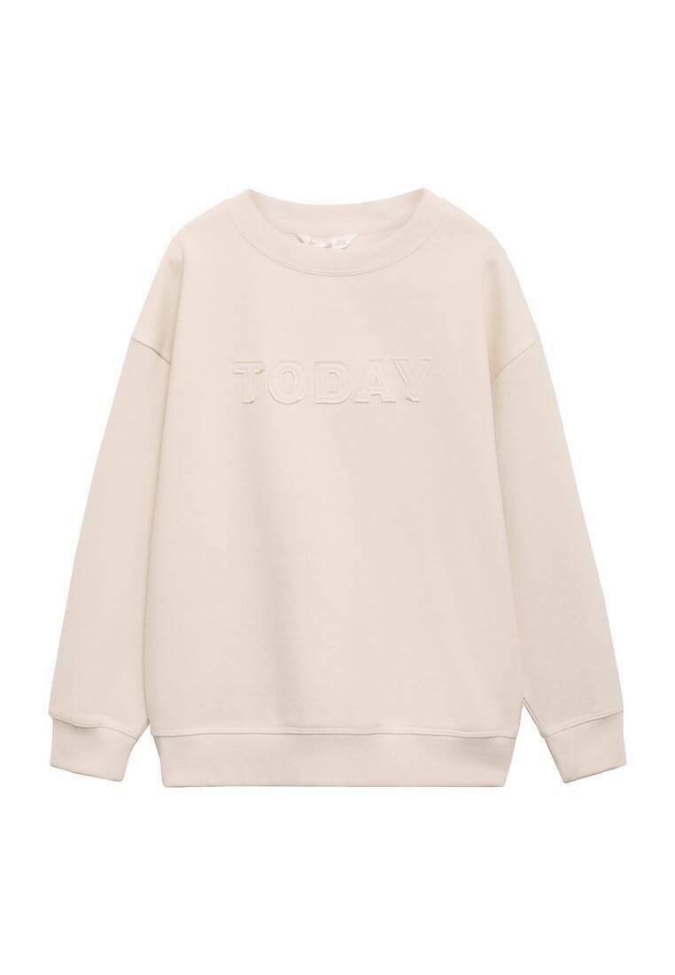 Svetlo bež pulover s kroječem okoli vratu, dolgimi rokavi in teksturiranim napisem 'DANES' na sprednji strani. Mehka tkanina, sproščen kroj.