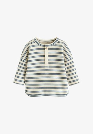 Maglione a maniche lunghe color crema con strisce orizzontali blu, dotato di scollo rotondo e patta con bottoni davanti. Tessuto testurizzato.