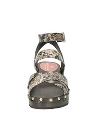 Strappy platform sandal with a snakeskin pattern in shades of gray and brown, featuring a buckle strap and studded accents along the sole.