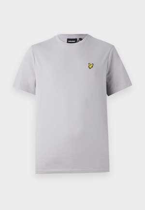 Világosszürke pamut póló rövid ujjakkal, bal oldalon egy apró sárga hímzett madárlogóval.