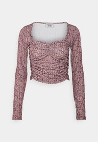 Camisola de manga longa em rosa claro com padrão de leopardo, apresentando um design franzido e um decote quadrado. Feita de tecido elástico.