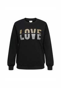 Melnā džemperis ar vārdu "MĪLESTĪBA" treknā fontā, augšējā daļā leoparda raksts, apakšējā daļā pelēks, un starp tiem neliels kursīvs uzraksts.