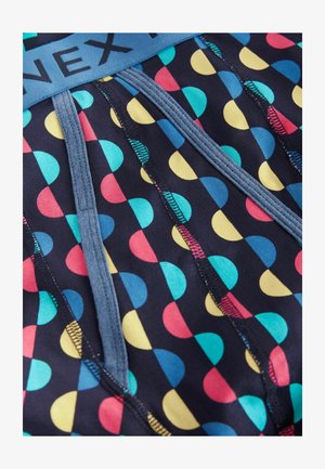 Men's boxer briefs in navy fabric with multicolored polka dot pattern. Features a soft waistband and visible seams for added detail.