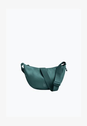 Sac bandoulière vert avec une sangle large réglable et une fermeture éclair, affichant un logo discret "GOT BAG" au centre avant.