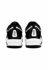 Scarpe sportive nere con tomaia in sintetico liscio, dettagli bianchi e colletto imbottito. Presentano un'unità Air visibile nel tallone.