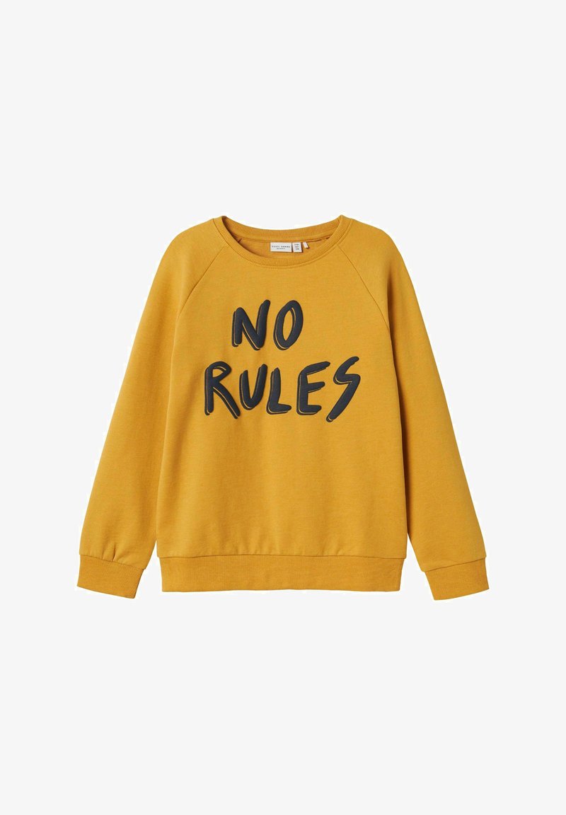 Sudadera amarilla con letras negras que dice "SIN REGLAS", con mangas raglán y cuello redondo ribeteado y puños.