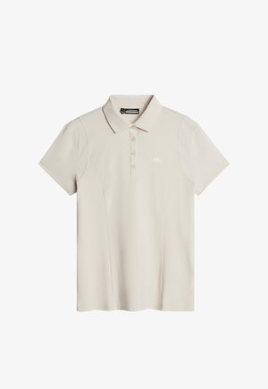 Beige polotröja med klassisk krage, korta ärmar och femknapplåda. Har texturerade axelaccenter och en liten logotyp.