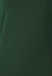 Dark green cotton t-shirt with a smooth texture and a simple design. Features a classic crew neck and short sleeves. No visible patterns or logos.