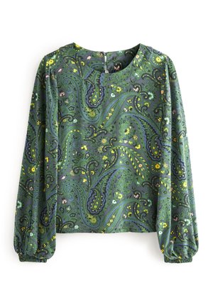 Grøn bluse med lange ærmer og elastiske manchetter, med et indviklet paisley-mønster i nuancer af blå, gul og pink.