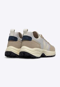 Beige and gray mesh and suede sneakers with black rubber outsole, featuring a navy heel tab and subtle logo detail on the back.
