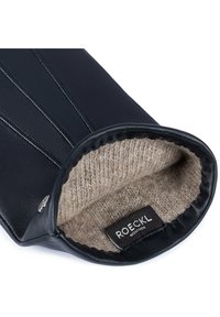 Schwarze Lederhandschuhe mit einem weichen beige Wolle Innenfutter. Eigenschaften vertikale Nähte und eine glatte Textur; Markenlabel innen sichtbar.