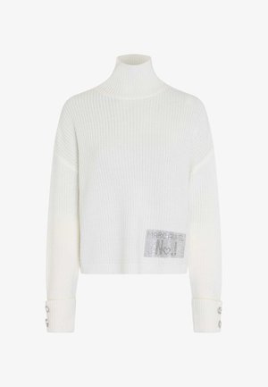 White ribbed knit sweater with a high neck, featuring a patch with logo detail and decorative buttons on the sleeves.