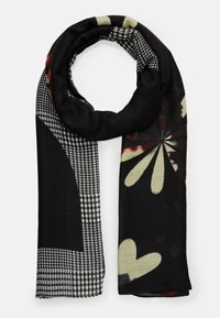 Écharpe noire présentant un mélange de motifs, notamment un pied-de-poule et des motifs floraux abstraits, avec des textures variées et une finition douce.