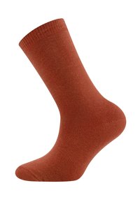 Chaussette texturée de couleur rouille avec un poignet côtelé, un corps lisse et une pointe arrondie. Fabriquée à partir d'un matériau doux et extensible pour le confort.