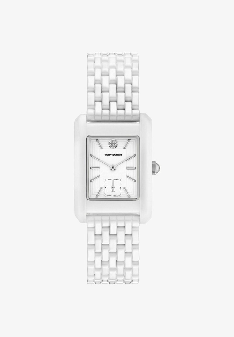 Montre-bracelet rectangulaire en céramique blanche avec bracelet à maillons, index argentés, petit cadran des secondes et logo Tory Burch sur le cadran.