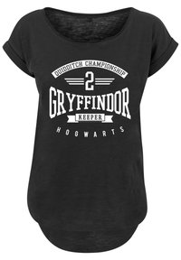 Svart T-skjorte med korte rullede ermer, med et hvitt trykk: "Quidditch Championship 2 Gryffindor Keeper Hogwarts."