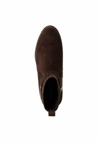 Botte de cheville en cuir suédé marron avec un bout arrondi, une fermeture éclair sur le côté et une petite languette à l'arrière. Texture lisse et design minimaliste.