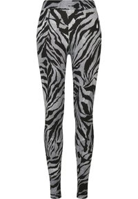 Zebra uzorka tajice u crnoj i sivoj boji, izrađene od rastezljivog materijala, s visokim strukom i prilagođenim dizajnom za udobnost i kretanje.