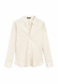 Lys beige langærmet skjorte lavet af struktureret stof, med mandarin krave, knaplukning og slidser i kanten.